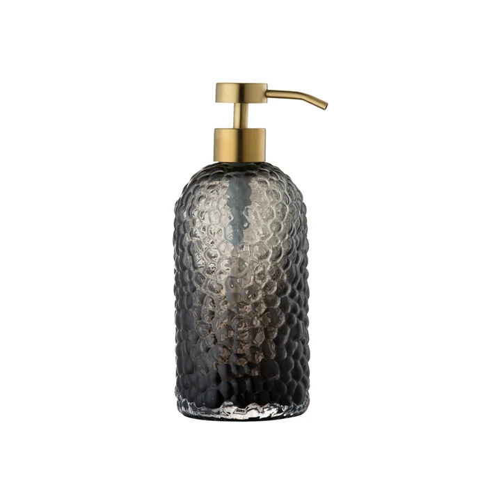 Le distributeur de savon Arura de AYTM , Ø 7,8 x H 16,2 cm, noir / or