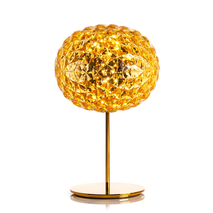 La lampe de table à LED Planet dimmable avec pied de Kartell en jaune